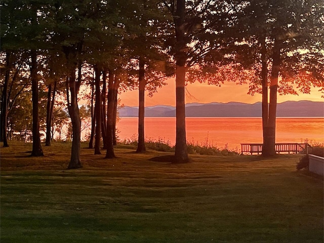 nature at dusk with a water and mountain view