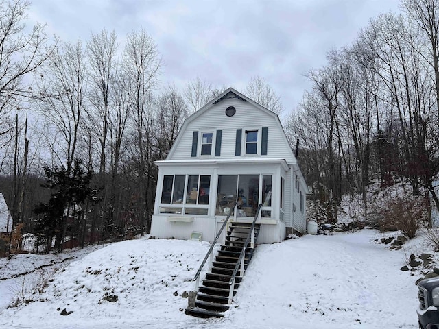 view of front of house with a sunroom