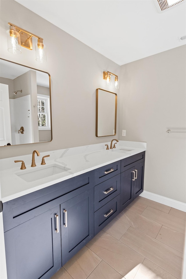 bathroom with vanity and walk in shower