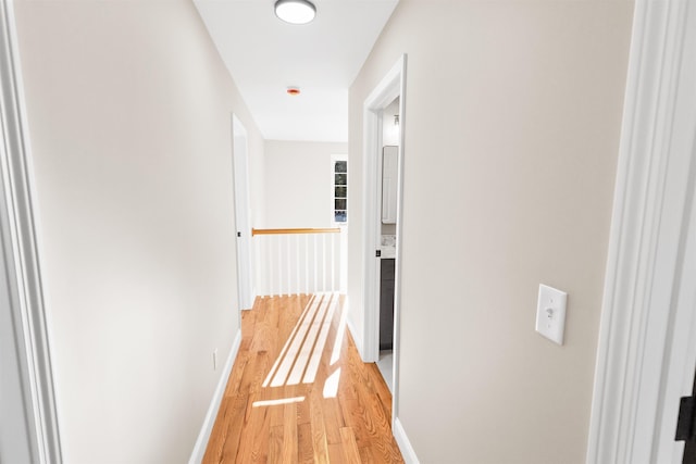 corridor featuring light hardwood / wood-style floors