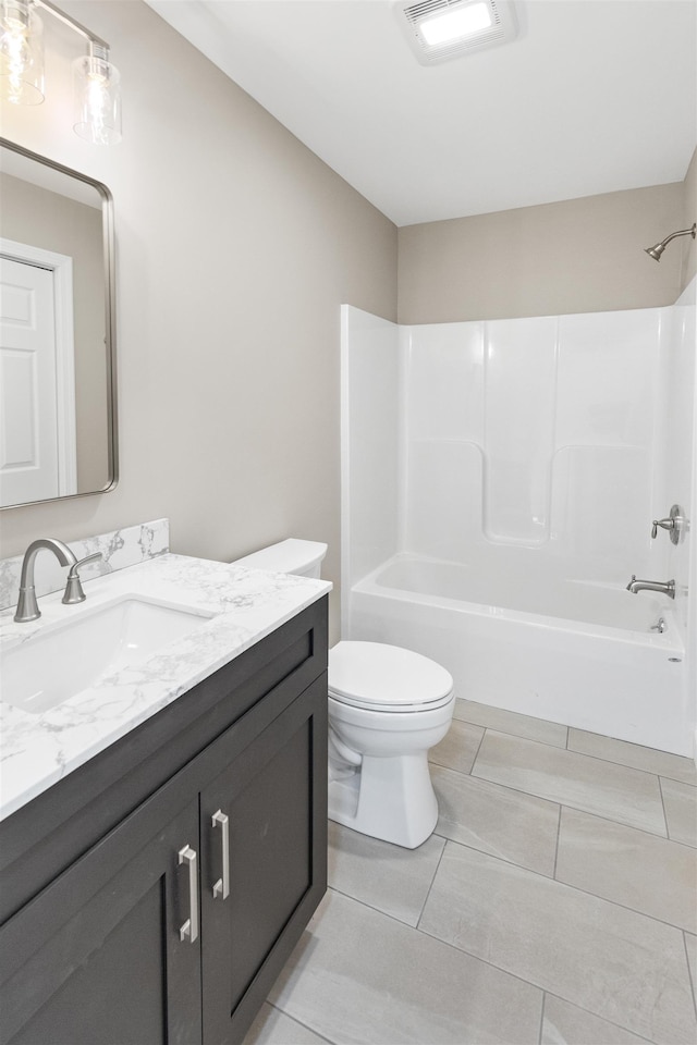 full bathroom featuring vanity, toilet, and shower / bathtub combination