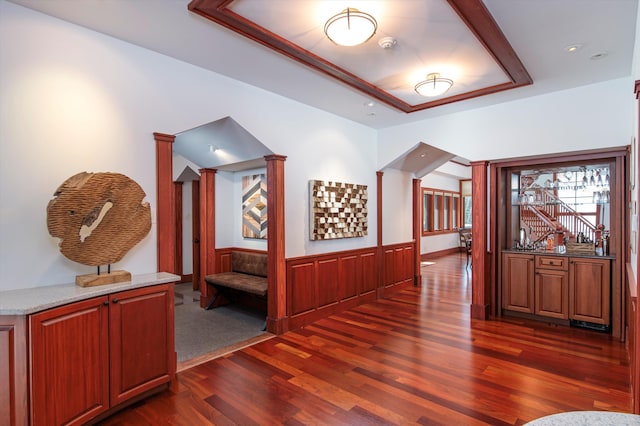 51 E Ash Rd, Plymouth, VT 05056 - corridor featuring a tray ceiling, ornate columns, and dark wood-type flooring