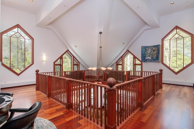 51 E Ash Rd, Plymouth, VT 05056 - interior space featuring hardwood / wood-style floors, a baseboard heating unit, vaulted ceiling, and an inviting chandelier