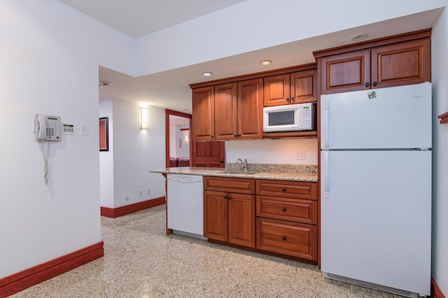 51 E Ash Rd, Plymouth, VT 05056 - kitchen with light stone counters, sink, and white appliances