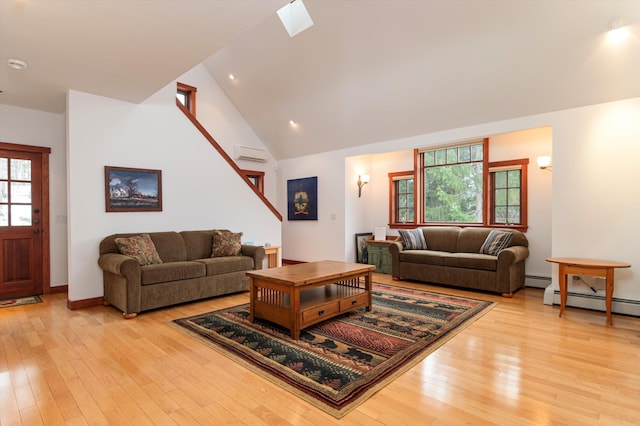 51 E Ash Rd, Plymouth, VT 05056 - living room featuring light hardwood / wood-style flooring, a wealth of natural light, and lofted ceiling with skylight