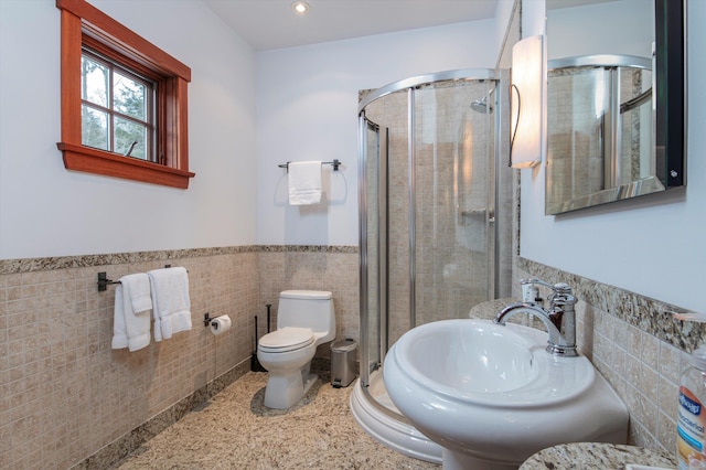 51 E Ash Rd, Plymouth, VT 05056 - bathroom featuring toilet, sink, a shower with door, and tile walls