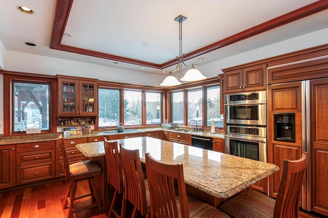 51 E Ash Rd, Plymouth, VT 05056 - kitchen featuring dishwasher, a center island, a breakfast bar area, and a tray ceiling