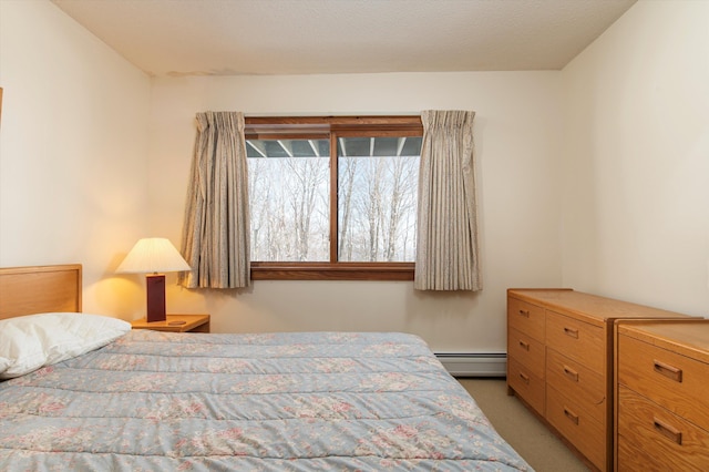 360 Okemo Trailside Ext Unit 37C, Ludlow, VT 05149 - bedroom with baseboard heating and light colored carpet