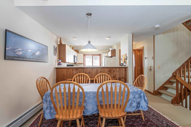 360 Okemo Trailside Ext Unit 37C, Ludlow, VT 05149 - carpeted dining room featuring a baseboard heating unit and stairway