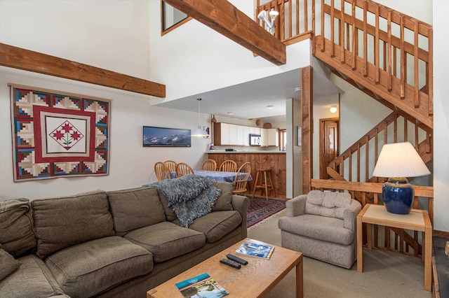 360 Okemo Trailside Ext Unit 37C, Ludlow, VT 05149 - living area with a high ceiling, carpet, and stairway