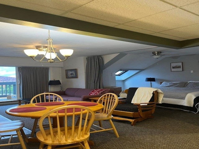 dining room featuring carpet, a drop ceiling, and ceiling fan with notable chandelier