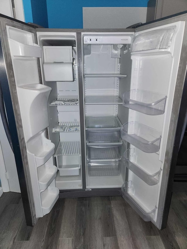 details featuring refrigerator and dark hardwood / wood-style floors