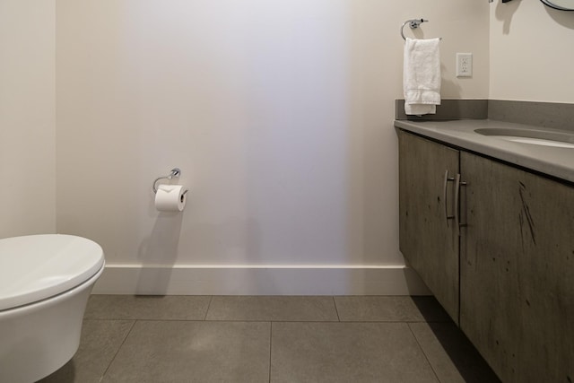 bathroom with vanity, tile patterned floors, and toilet