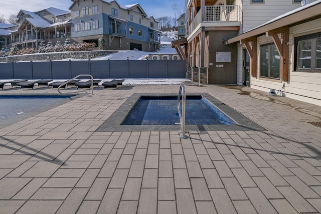 view of pool with a community hot tub and a patio area