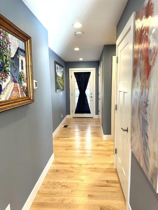 doorway with light hardwood / wood-style floors