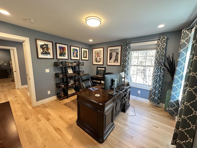 office area with light hardwood / wood-style flooring