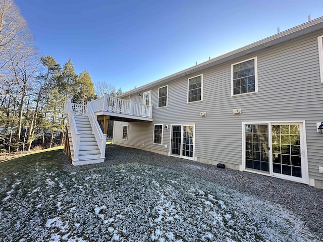 rear view of property featuring a deck