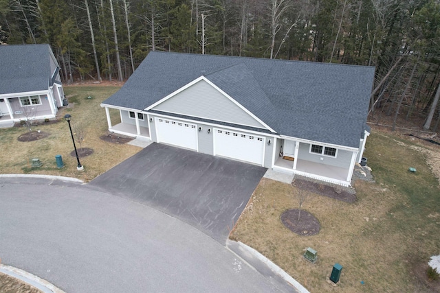 view of front of home with covered porch and a front yard