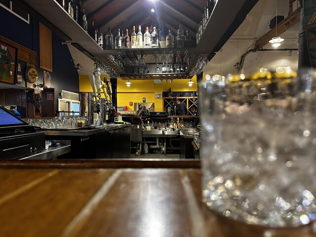 bar with a workshop area and finished concrete floors