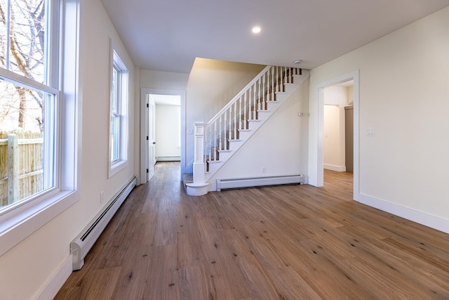 interior space featuring hardwood / wood-style floors and a baseboard radiator