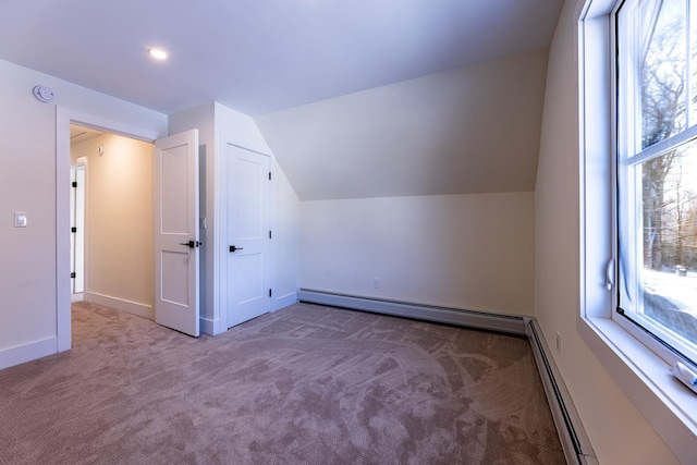 bonus room with carpet, baseboard heating, and vaulted ceiling