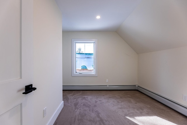 bonus room featuring lofted ceiling, carpet floors, and a baseboard heating unit