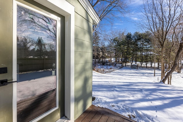 view of snow covered property entrance