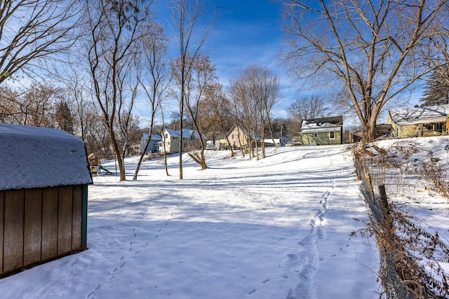 view of yard layered in snow