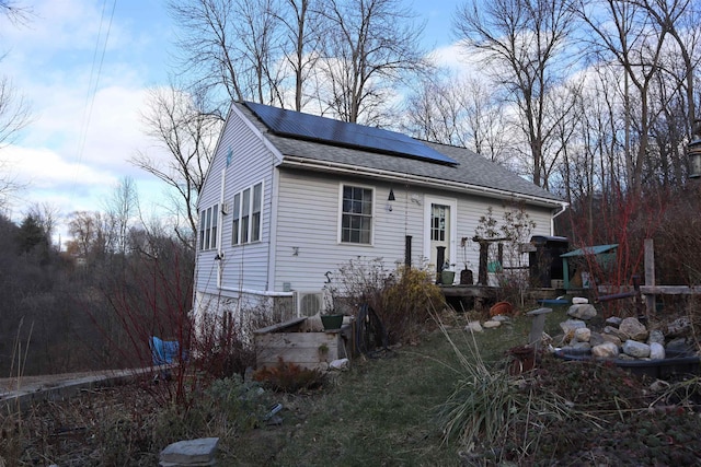 view of front of property with solar panels