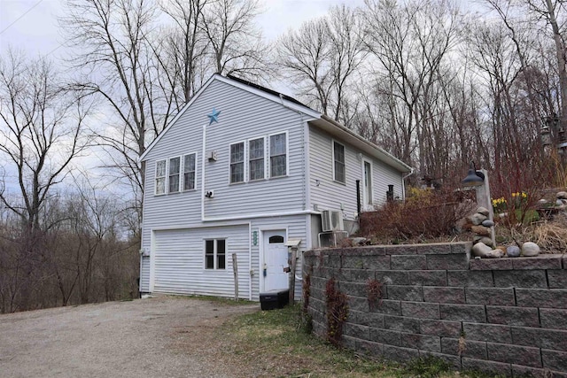view of property exterior featuring aphalt driveway