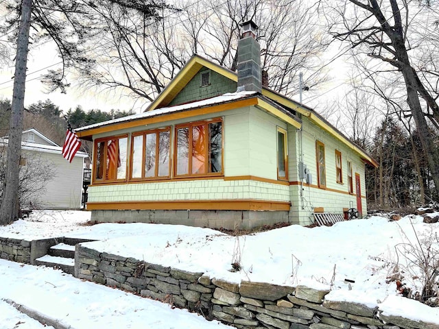 view of front of house featuring a sunroom