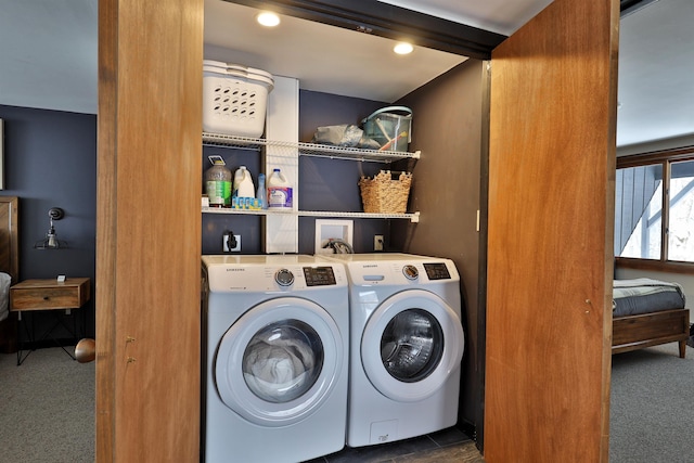 laundry area featuring separate washer and dryer and dark carpet