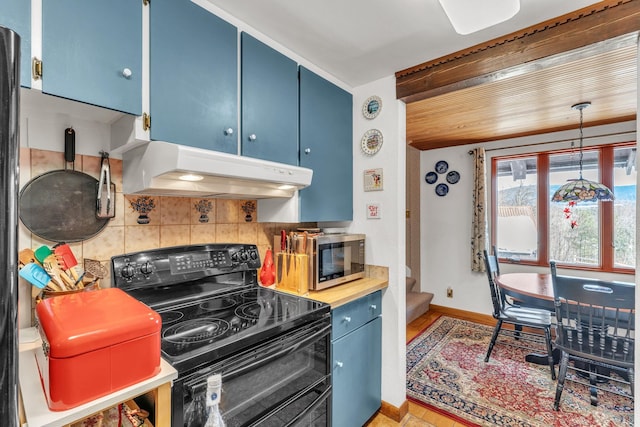 kitchen with decorative backsplash, light wood-type flooring, black range with electric cooktop, blue cabinetry, and pendant lighting