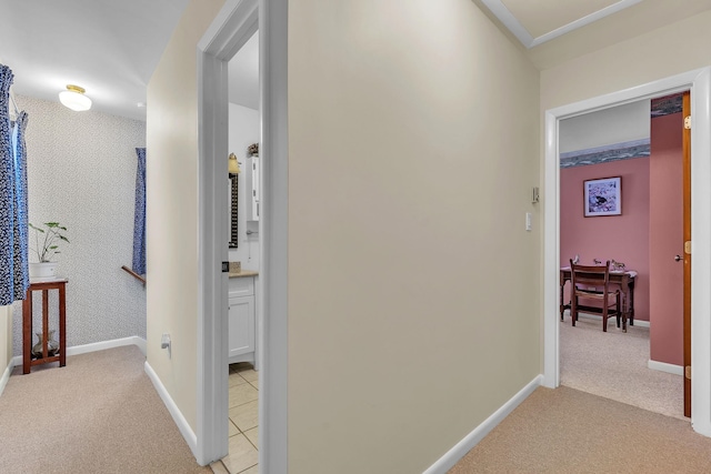 hallway featuring light carpet