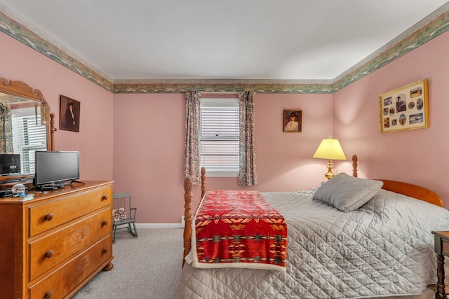 bedroom featuring multiple windows and light colored carpet