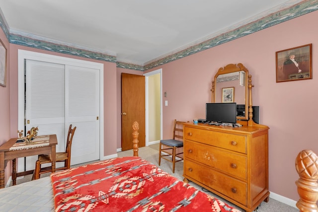 carpeted bedroom with a closet