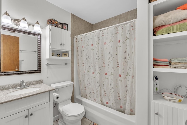 full bathroom with vanity, shower / bath combination with curtain, and toilet