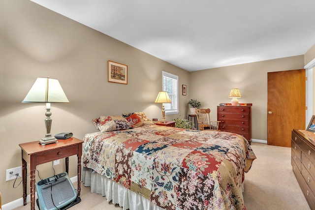 bedroom featuring light carpet