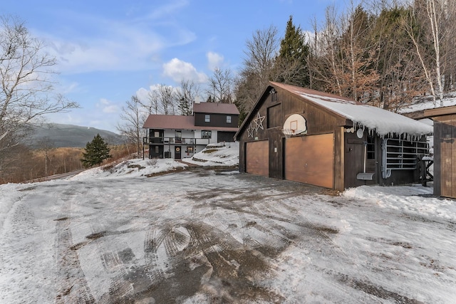 exterior space featuring a mountain view and an outbuilding