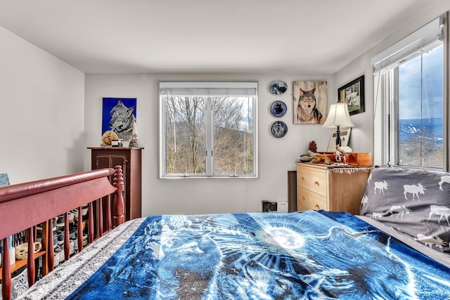 bedroom featuring multiple windows