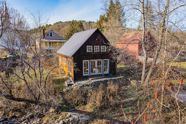 back of house featuring french doors