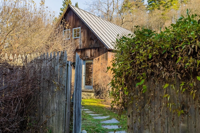 view of property exterior featuring an outbuilding