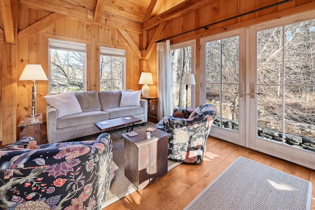 sunroom featuring lofted ceiling and wood ceiling