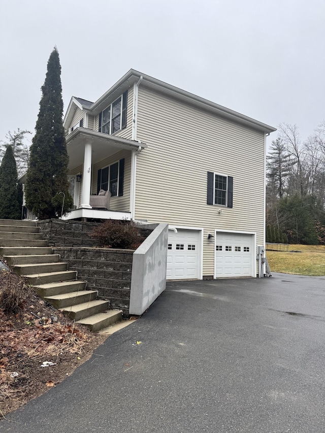 view of side of property with a garage