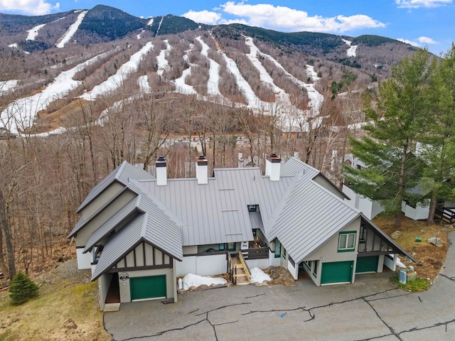 snowy aerial view with a mountain view