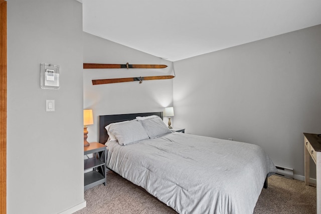 carpeted bedroom featuring baseboard heating