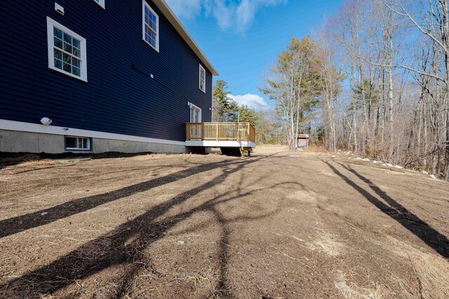 view of side of home with a deck