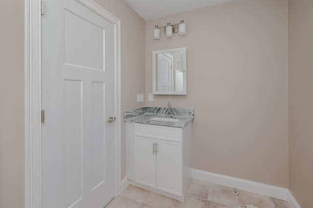 bathroom with tile patterned flooring and vanity