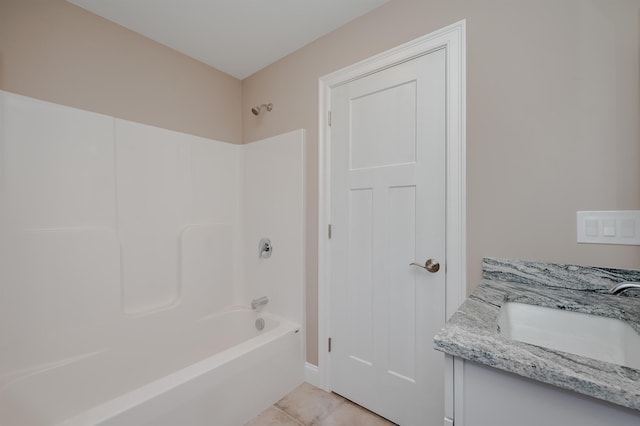 bathroom with tile patterned flooring, vanity, and shower / washtub combination