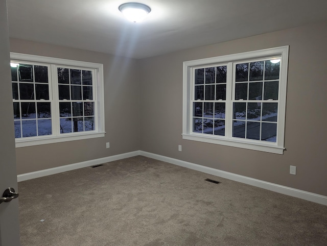 empty room featuring carpet flooring